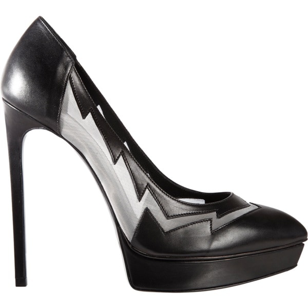Saint Laurent's black-and-white Lightning Bolt pumps combine towering platform proportions with a graphic zigzag overlay, turning a classic pointed-toe silhouette into one of the brand's most recognizable statement heels of the 2010s
