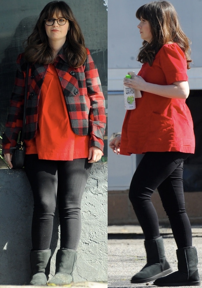 Zooey Deschanel on the set of 'New Girl' in Los Angeles, California, on February 1, 2017, rocking a cozy and stylish maternity look with a plaid overcoat, red blouse, black leggings, and classic black UGG boots