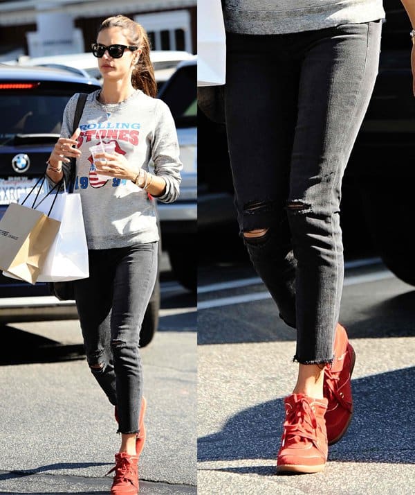 Alessandra Ambrosio was seen in Brentwood on January 25, 2014, wearing a Rock Your Saturday Rolling Stones sweatshirt, J Brand Photo Ready cropped skinny jeans in Mercy, Isabel Marant Betty leather and suede wedge trainers, and a Jacquie Aiche triangle blue topaz crystal bezel necklace