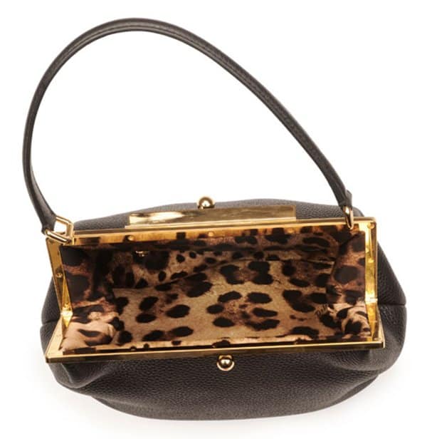 Golden hardware structures this Dolce Gabbana bag's classic frame top, countered by the soft slouch of pebbled calfskin
