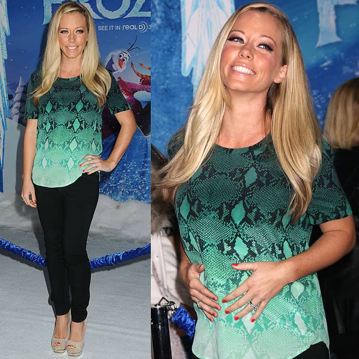 Kendra Wilkinson cradles her baby bump at the Frozen world premiere in Hollywood, pairing black skinny maternity jeans with a green ombré top and beige peep-toe platform heels