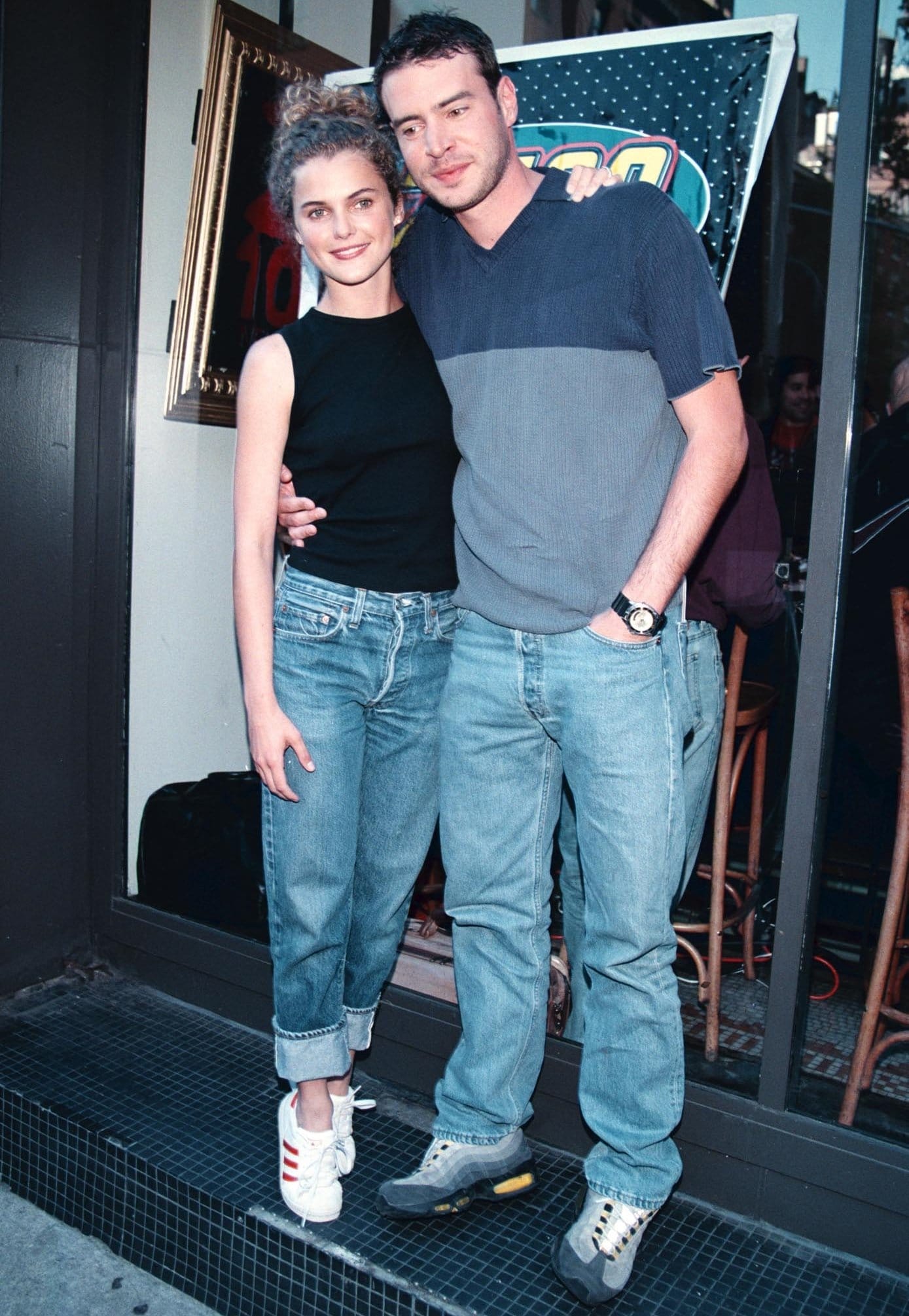 Keri Russell and Scott Speedman embrace late-'90s casual style in rolled-cuff jeans and sneakers while promoting Felicity in New York City on January 24, 1999, shortly before their off-screen romance became tabloid news