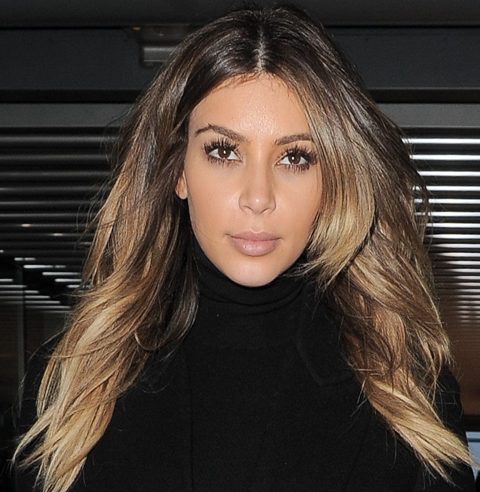 Kim Kardashian wears her hair down during a day out in London