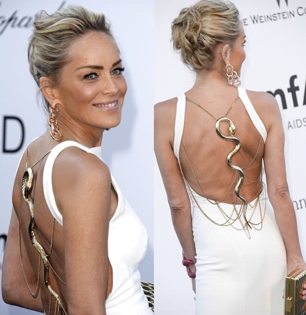 Sharon Stone captivates in a white gown featuring a dramatic snake accessory at amfAR's 20th Annual Cinema Against AIDS during the Cannes Film Festival