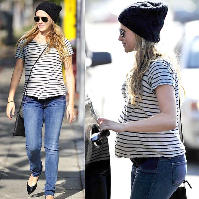 Teresa Palmer keeps her maternity look effortlessly chic in super-slim J Brand maternity jeans, pairing the stretchy denim with a striped tee, black beanie, and pointed black flats