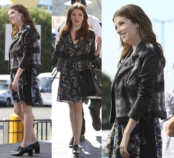 Anna Kendrick looks effortlessly chic in a dark floral dress paired with a leather-trimmed plaid moto jacket while arriving on the set of Extra