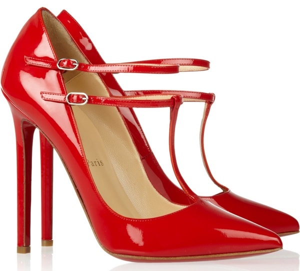 Christian Louboutin “V-Neck” T-Strap Pumps — glossy red patent leather stilettos featuring sharply pointed toes, an elegant T-bar with double ankle straps, and a sky-high heel that creates a sleek, leg-lengthening silhouette, finished with the brand’s signature red sole