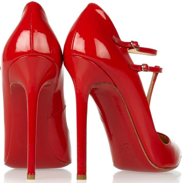 Christian Louboutin “V-Neck” T-Strap Pumps — glossy red patent leather stilettos featuring sharply pointed toes, an elegant T-bar with double ankle straps, and a sky-high heel that creates a sleek, leg-lengthening silhouette, finished with the brand’s signature red sole