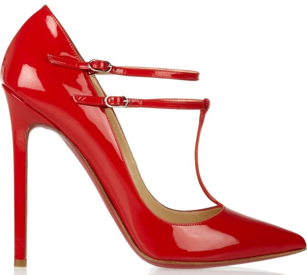 Christian Louboutin “V-Neck” T-Strap Pumps — glossy red patent leather stilettos featuring sharply pointed toes, an elegant T-bar with double ankle straps, and a sky-high heel that creates a sleek, leg-lengthening silhouette, finished with the brand’s signature red sole