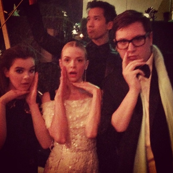 Hailee Steinfeld, Jaime King, and Jared Eng (founder of Just Jared) pose with photographer Justin Campbell, who is seen on the right, making a thoughtful gesture