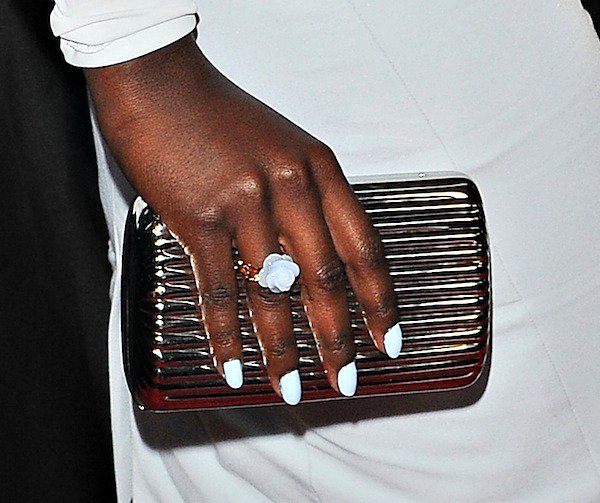Lupita Nyong'o toting a metallic clutch from Monica Rich Kosann