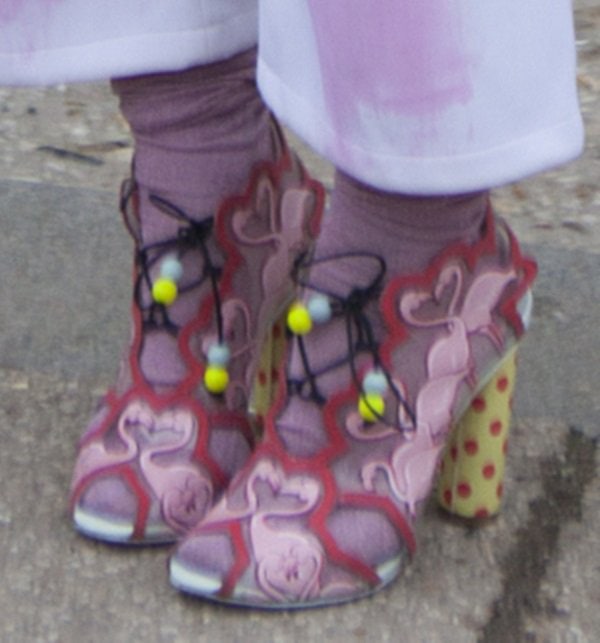 Fashion blogger Susie Bubble makes a bold statement with whimsical cutout sandals adorned with playful beaded details and paired with colorful socks