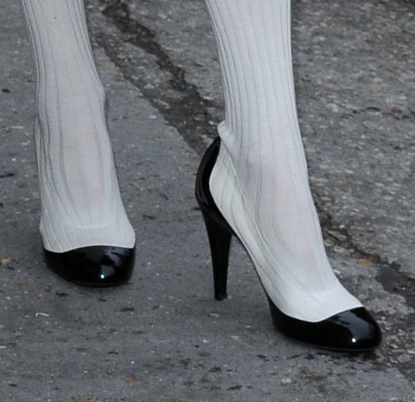 Tilda Swinton pairs her unique ensemble with bold color-blocked pump-boot hybrids