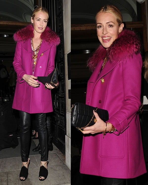 Cat Deeley arrives at the Matthew Williamson show during London Fashion Week on February 16, 2014, pairing a vibrant fuchsia coat and leather trousers with sleek black open-toe heels that add polish to the bold look