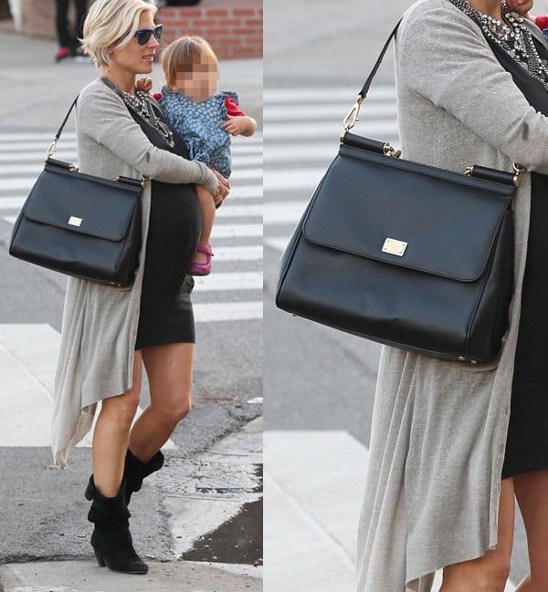 Pregnant Elsa Pataky shops with her daughter, India Hemsworth, carrying a Dolce Gabbana "Miss Sicily" bag on February 12, 2014