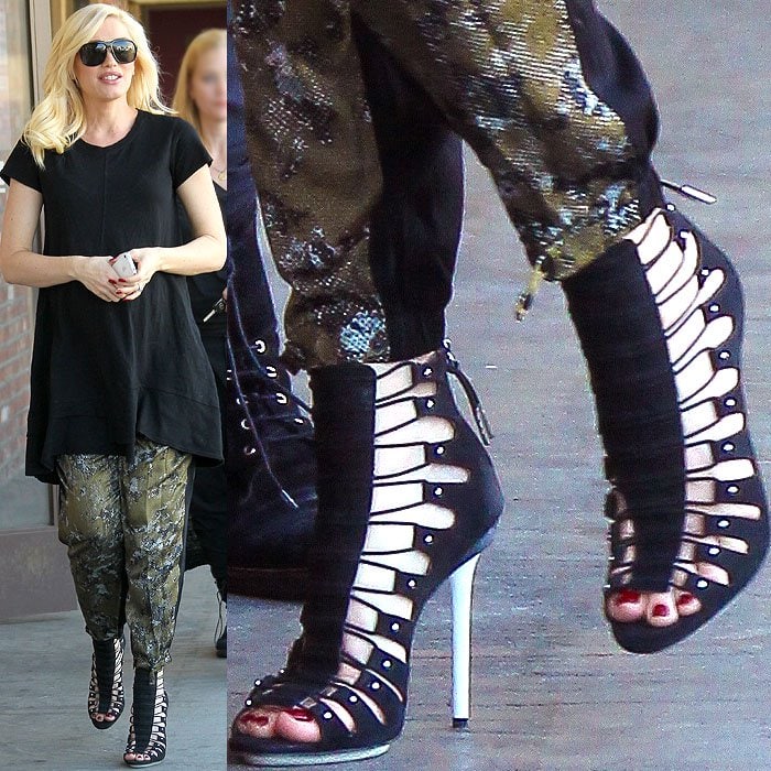 Gwen Stefani wearing black strappy sandal booties