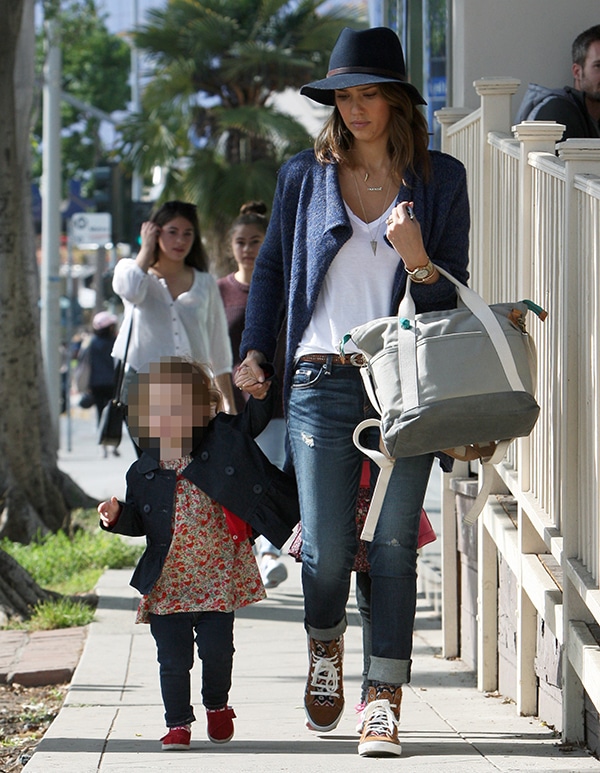 Jessica Alba keeps it effortlessly chic in a wide-brim hat, distressed cuffed jeans, and Tory Burch “Noah” hi-top sneakers while taking her daughters, Honor and Haven, to lunch at Le Pain Quotidien in West Hollywood on February 9, 2014