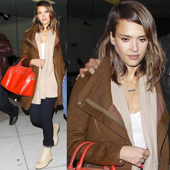 Jessica Alba leaves Craig’s restaurant in West Hollywood after a dinner date with husband Cash Warren on February 3, 2014, wearing layered neutrals — a tan jacket, beige cardigan, and nude Weber Hodel Feder boots paired with a bold red Tory Burch satchel