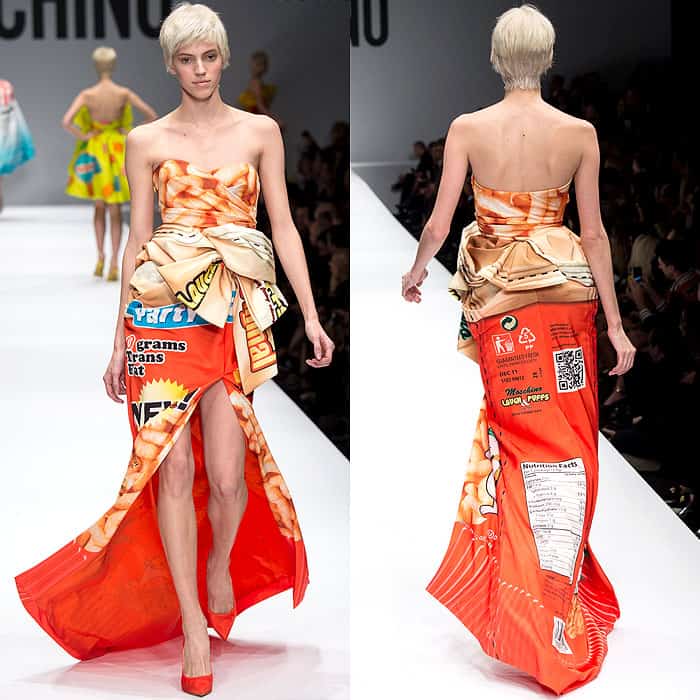 Moschino Fall 2014 features a stylish, strapless gown inspired by snack packaging, complete with nutrition facts graphics and a dramatic high slit, paired with red heels