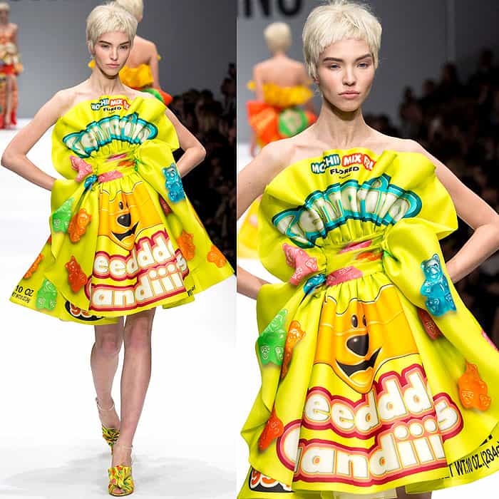 Moschino Fall 2014 showcases a vibrant, strapless yellow mini-dress inspired by gummy bear candy packaging, featuring a voluminous, ruffled silhouette and coordinating embellished heels