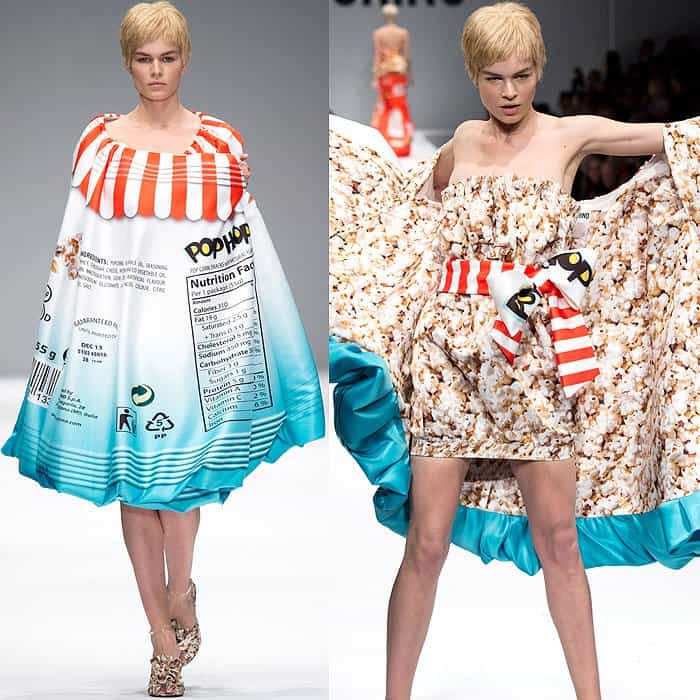 Moschino Fall 2014 showcases a playful dress designed to resemble popcorn packaging, featuring a ruffled neckline, a full skirt, and a print with nutrition facts, paired with textured gold heels