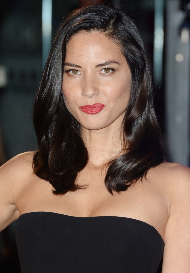 Olivia Munn's hair was swept to one side and fell softly down her shoulders