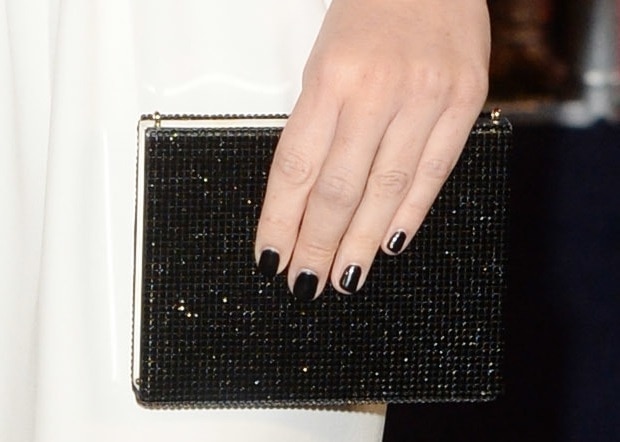 Olivia Munn totes an embellished clutch from Armani