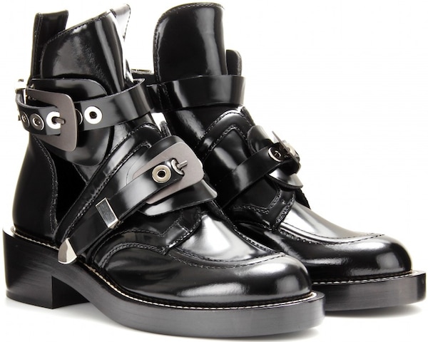 Balenciaga's black leather "Ceinture" ankle boots combined industrial-inspired hardware with sculptural cutouts, becoming one of the brand's defining archival designs