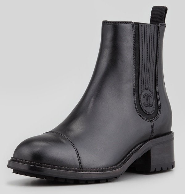 Chanel pull-on leather Chelsea ankle boots, featuring elastic gussets, a lugged sole, and a timeless black leather finish