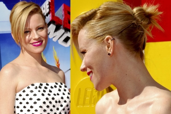 Elizabeth Banks' hair was swept to one side and styled in a messy bun to show off her ear cuff from Jack Vartanian