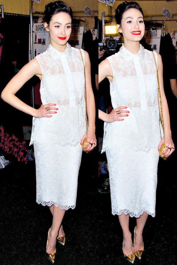 Emmy Rossum in a sleeveless, collared sheer blouse over a white bandeau and a pencil skirt