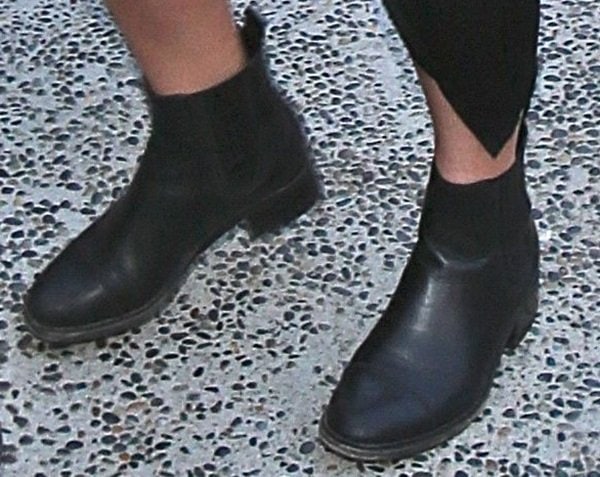 A closer look at Kylie Jenner’s Chanel pull-on Chelsea boots reveals their smooth leather upper, elastic side panels, and low stacked heel designed for all-day wear