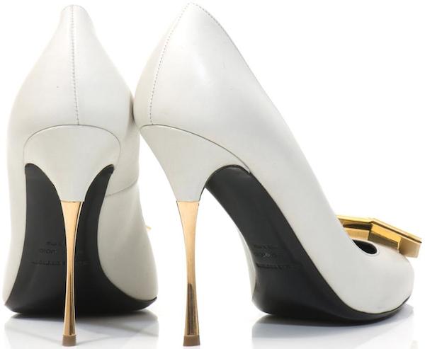 White leather Nicholas Kirkwood “Hexagon” pumps featuring sharp pointed toes, a sculptural gold heel, and geometric resin detailing that adds architectural edge to an otherwise minimalist silhouette
