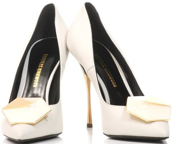 White leather Nicholas Kirkwood “Hexagon” pumps featuring sharp pointed toes, a sculptural gold heel, and geometric resin detailing that adds architectural edge to an otherwise minimalist silhouette