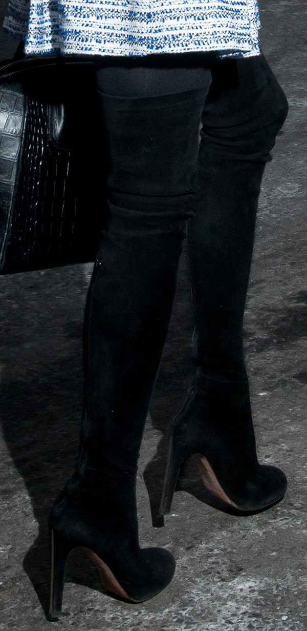Olivia Palermo's black over-the-knee, high-heeled suede boots