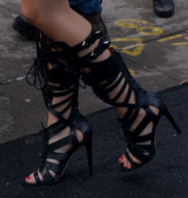 Victoria Justice steps out in fierce black gladiator heels, perfectly paired with a bold red pedicure for an effortlessly chic look