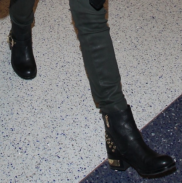 Anna Kendrick's studded gold-heeled boots