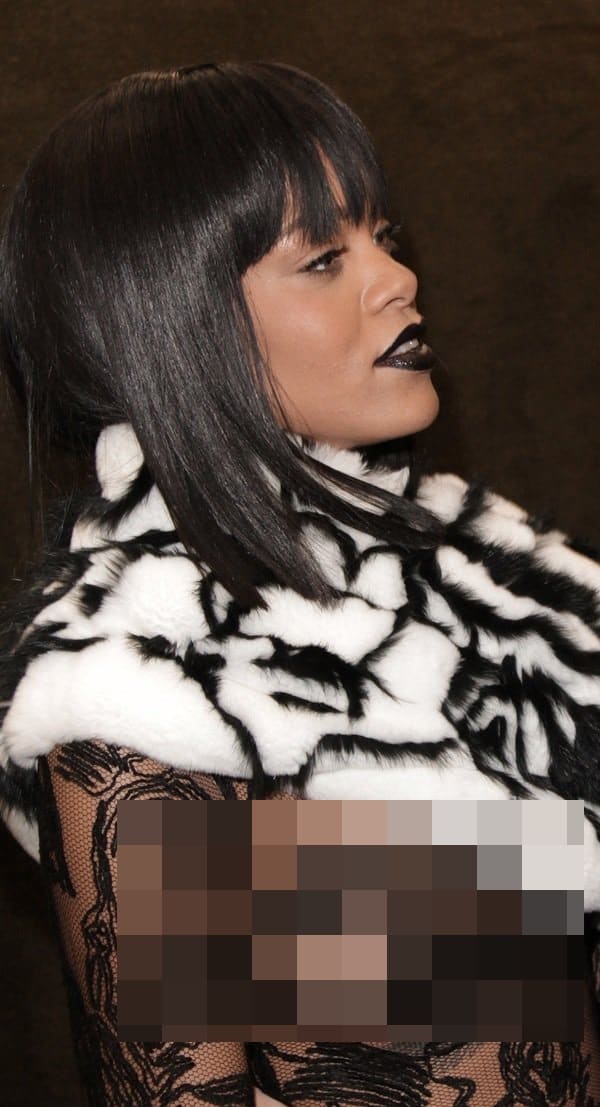 Rihanna baring a breast in a sheer Jean Paul Gaultier creation, covered on one side with a black-and-white infinity wrap on March 1, 2014