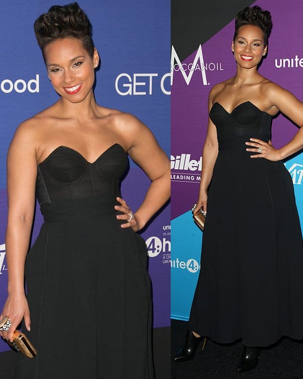 Alicia Keys wearing a chic all-black ensemble featuring a Fleur du Mal bustier and Proenza Schouler wide-legged pants, giving the illusion of a maxi dress