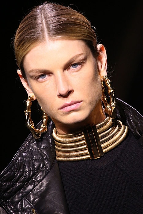 Details of bamboo hoop earrings and African-inspired stacked collar necklace