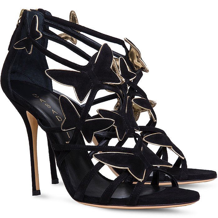 The black suede version adds contrast and edge, with sculptural butterfly accents outlined in metallic gold for a sharper, evening-ready finish