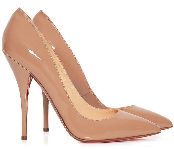 Christian Louboutin “Batignolles” pumps in glossy nude patent leather with a sharply pointed toe and slender stiletto heel