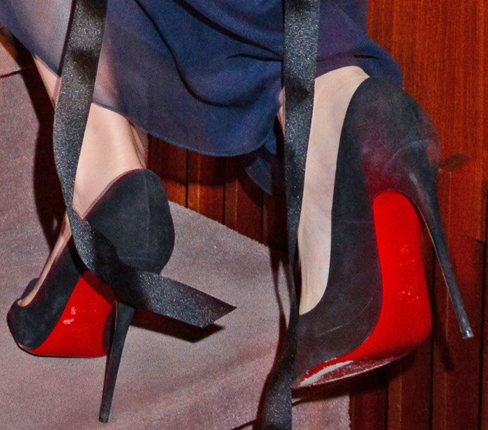 Emma Watson's feet in red-soled Christian Louboutin pumps