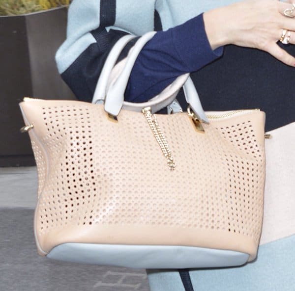 A close-up of Jessica Alba’s stylish perforated Chloe Baylee satchel