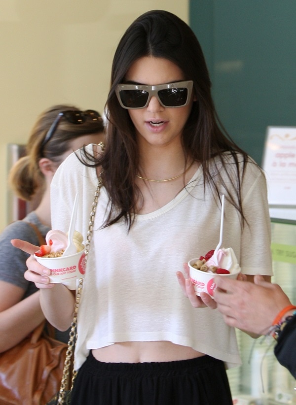Kendall Jenner keeps her casual look chic in a cropped tee and Céline CL 41804/S “Matrix Slo-70” sunglasses