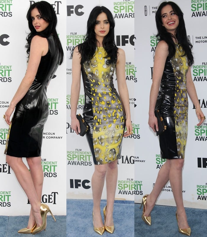 Krysten Ritter exudes sleek confidence in a yellow-and-black Versace body-con dress with glossy vinyl panels, styled with gold Rupert Sanderson pumps and a black Tyler Alexandra clutch