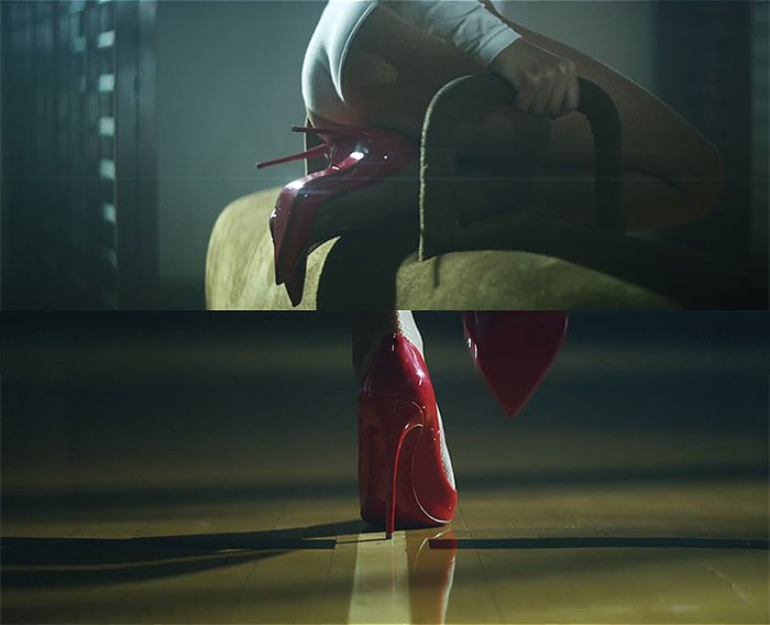 Kylie Minogue balances in glossy red Christian Louboutin stiletto heels during a sultry scene from the “Sexercize” music video