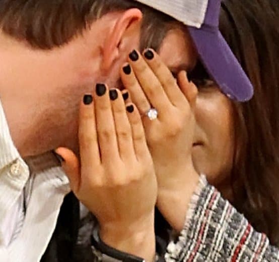 Mila Kunis proudly displaying her stunning 5-carat round-cut solitaire diamond engagement ring from Tiffany Co.