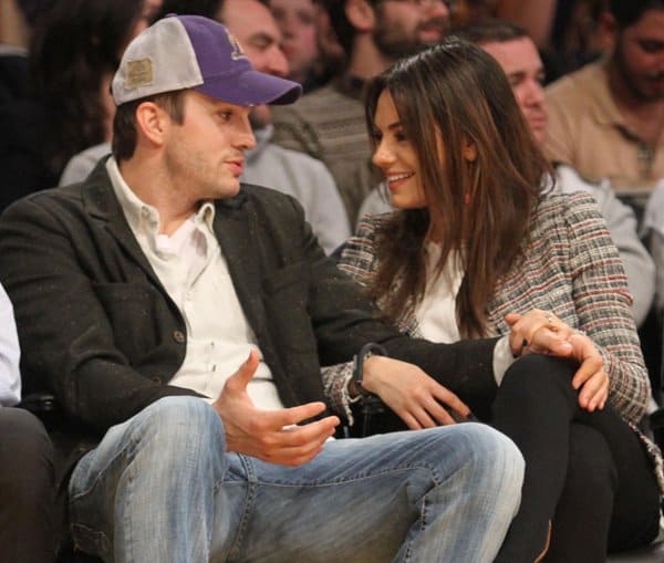 Mila Kunis and Ashton Kutcher shared a sweet moment at a Los Angeles Lakers game on March 4, 2014
