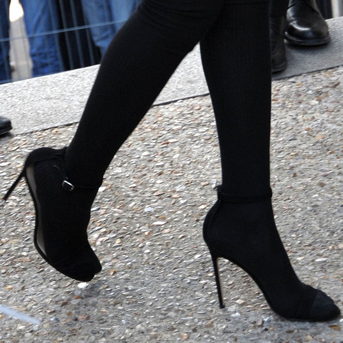 Rihanna completed her bold Paris Fashion Week look with sleek black Manolo Blahnik 'Chaos' sandals